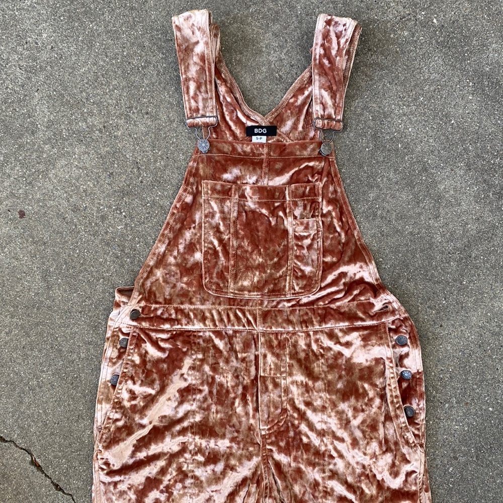 Womens crushed velvet overalls from Urban Outfitters.